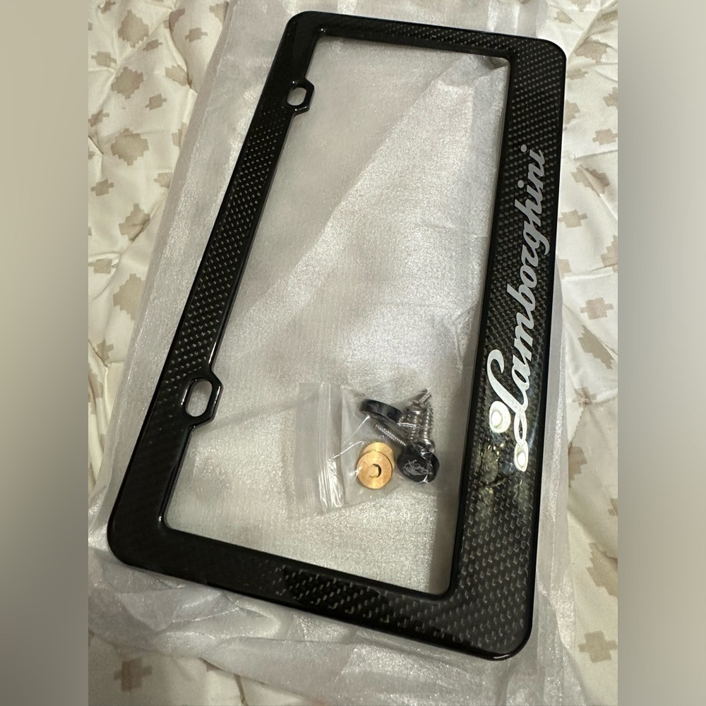 Lamborghini carbon license plate frame, and new with the hardware